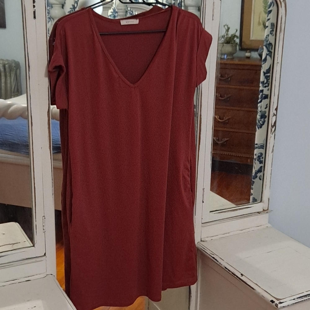 Medium, mauve, mid length dress, with side pockets